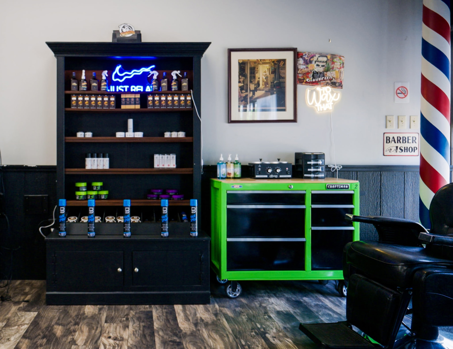 Product shelf, barber station, and barber pole inside RT8 Barbers
